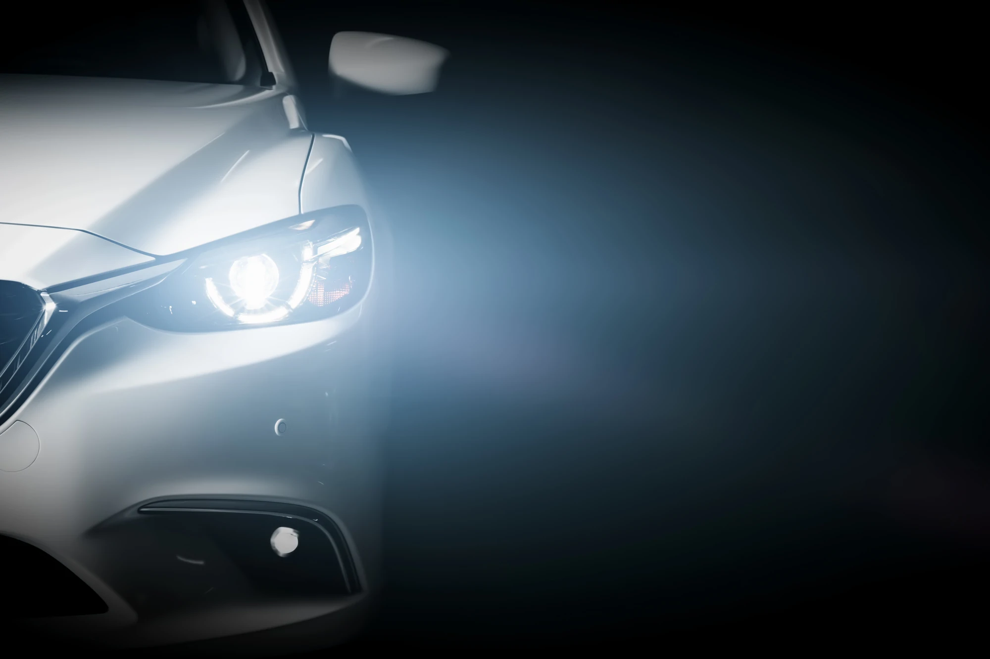 close-up of white car headlight