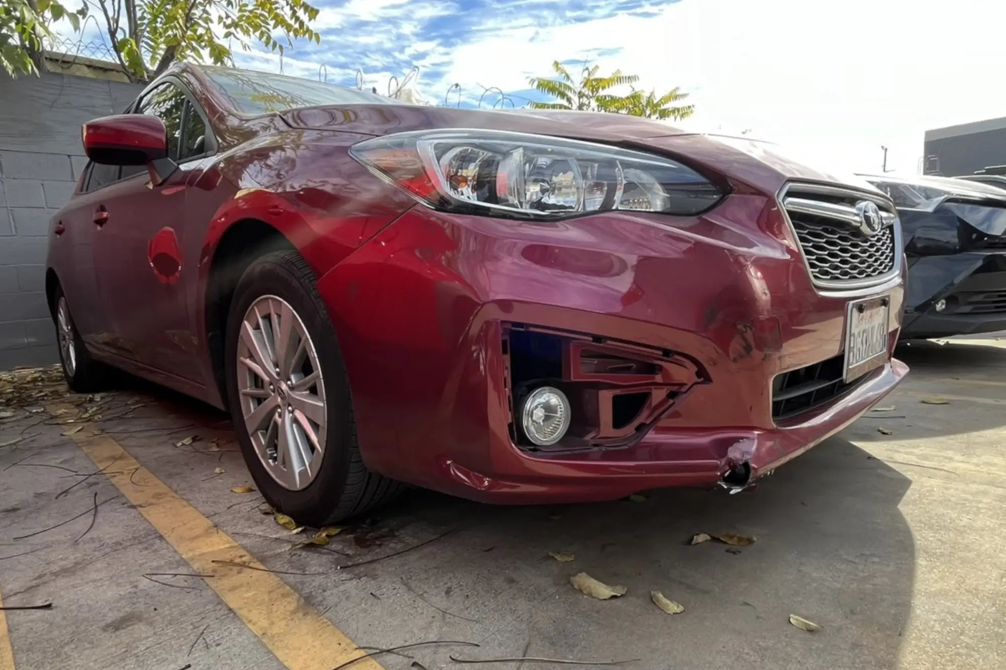 Vehicle before collision repair showing accident damage